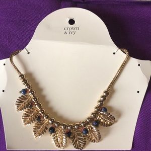 Crown & Ivy gold tone Tropical Isle necklace, gold leaves with rhinestones.